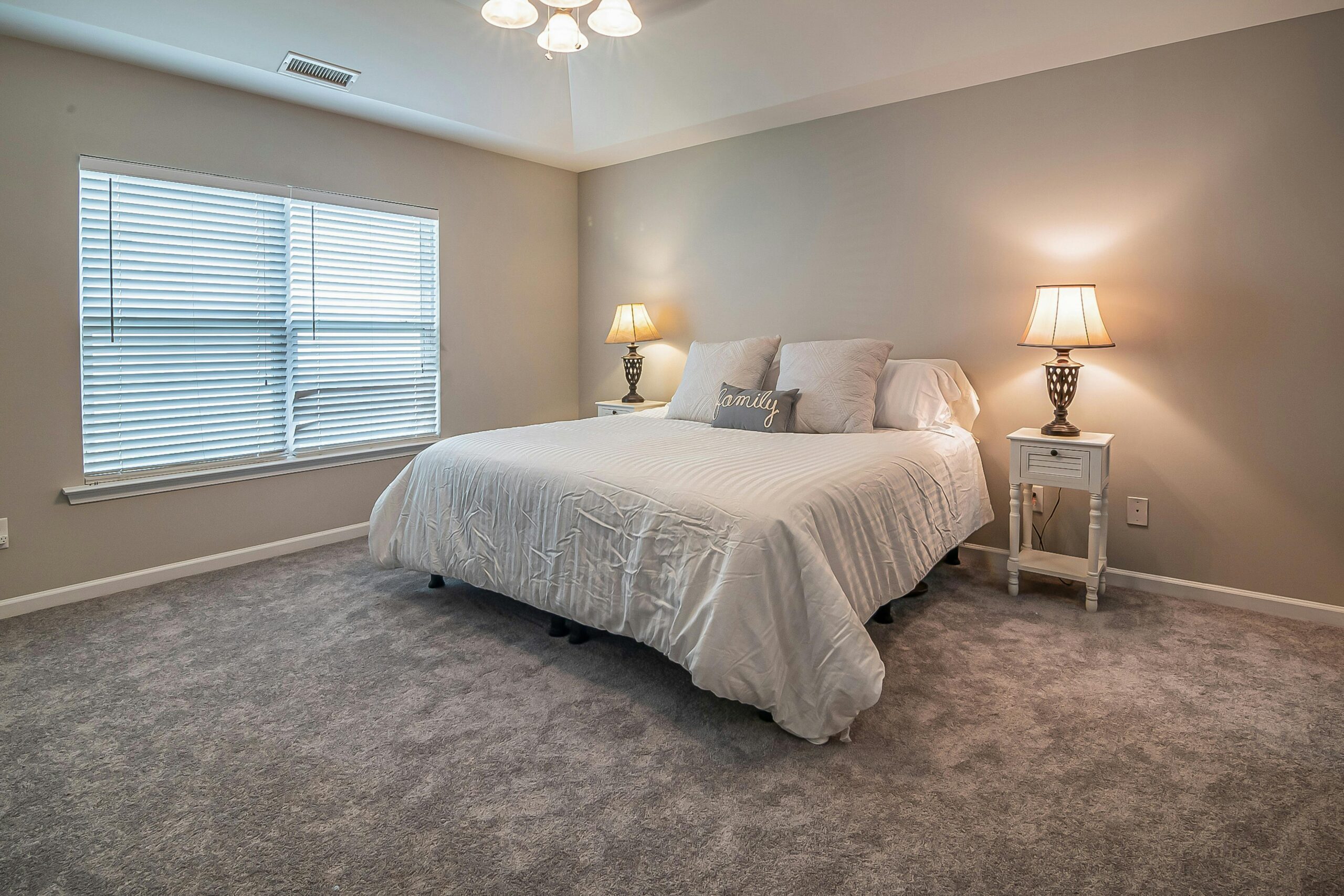 A modern and cozy bedroom with a king-size bed, soft lighting, and minimalist decor. Perfect for relaxation.